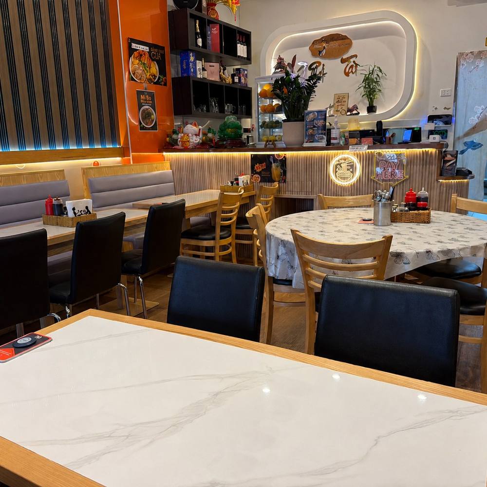 Inside Cô Năm 2 on Windsor Avenue: booths, counter and warm lighting
