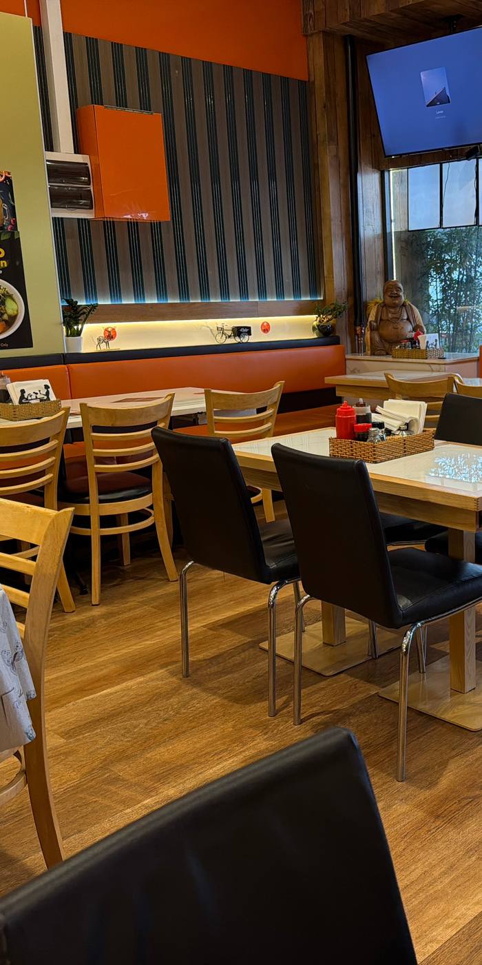 Inside Cô Năm 2 on Windsor Avenue: booths, counter and warm lighting