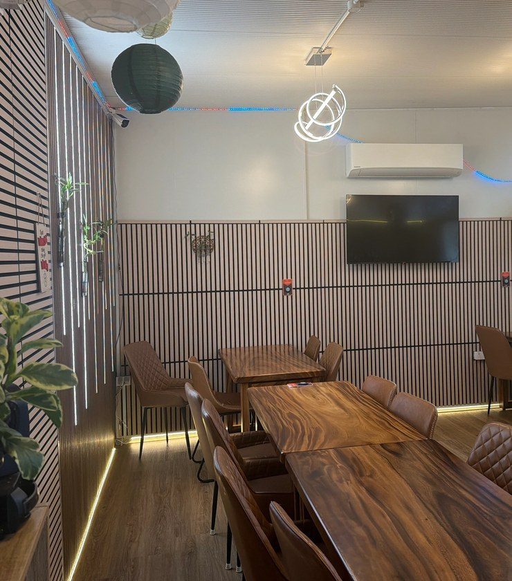 The private function room, long timber tables and slat walls